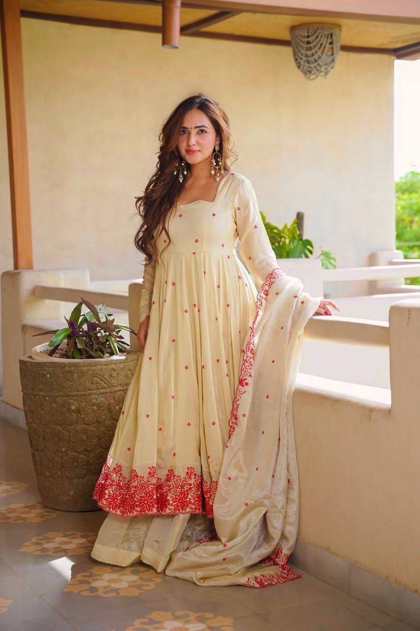 Exquisite Beige Flared Anarkali Suit Set Adorned with Vibrant Red Floral Embroidery, Sequined Scalloped Hem, and an Elegant Tie-Up Back